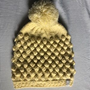Yellow beanie with pom Pom inside is fleece
